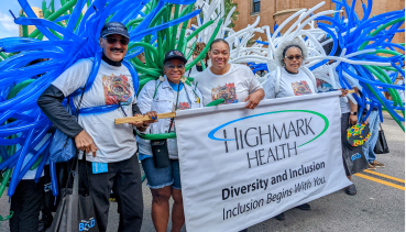 photo of a group of highmark health volunteers holding a diversity and inclusion banner