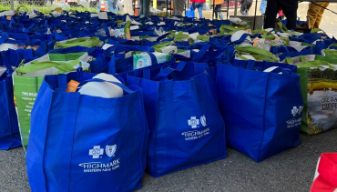 photo of a bunch of Highmark bags holding donations