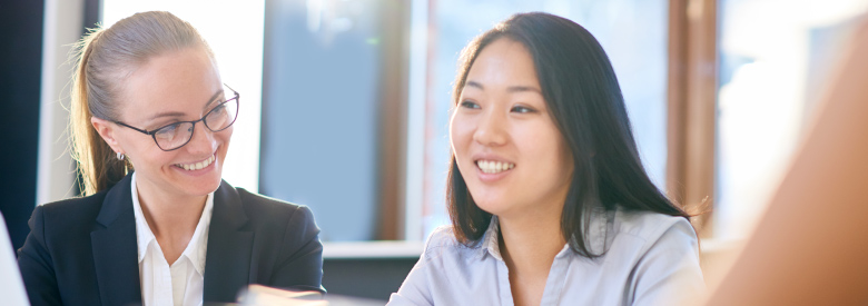 two women in an office meeting