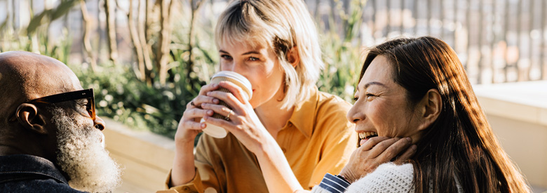 a group of employees on break enjoying a conversation on employee health benefits